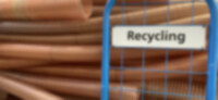 There is extruded hose waste in different sizes on a trolley which is driven to the recycling station. The trolley is marked with a 
